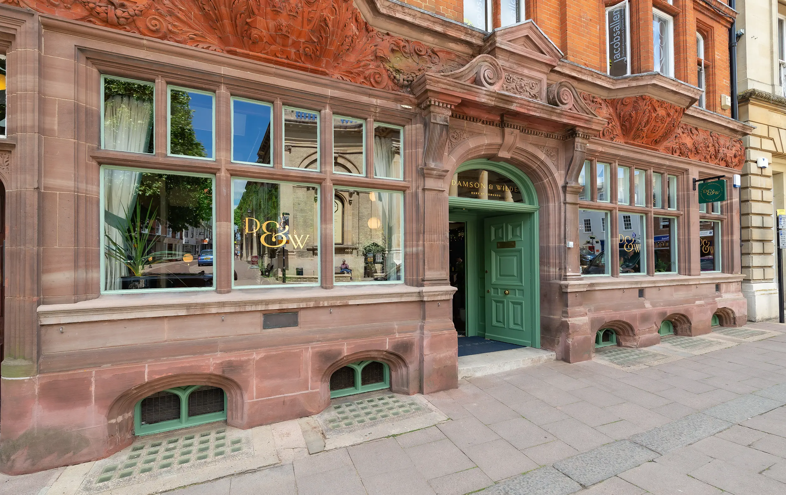 The Victorian red-stone frontage of Damson & Wilde on Abbeygate Street